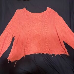 Pink cropped sweater with a beautiful knitted designs
